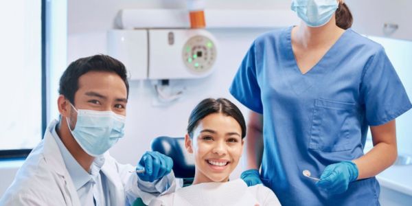 Modern dental office interior showing comfortable patient seating area and advanced dental equipment, representing a high-quality dental practice
